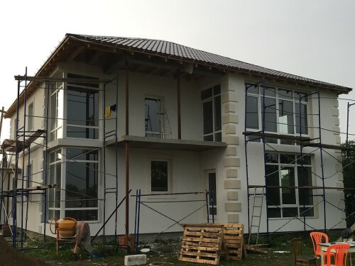 Отделка фасада дома штукатуркой в Молодечно
